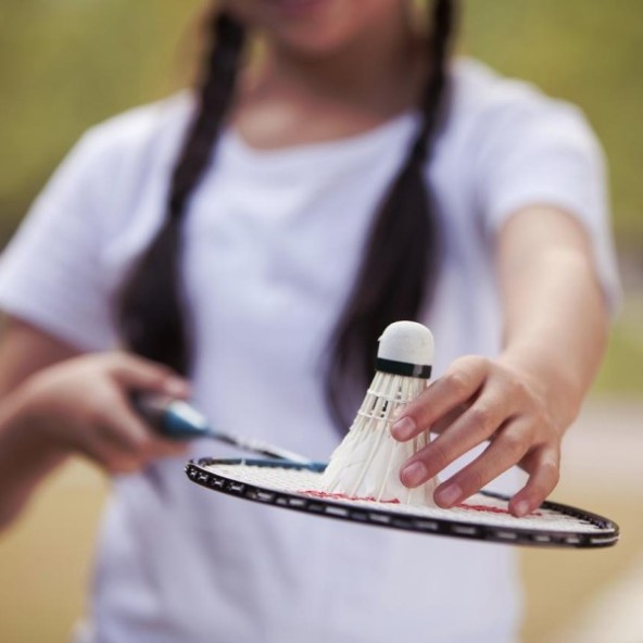A girl playing badminton
