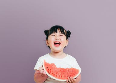 A girl eating a watermelon