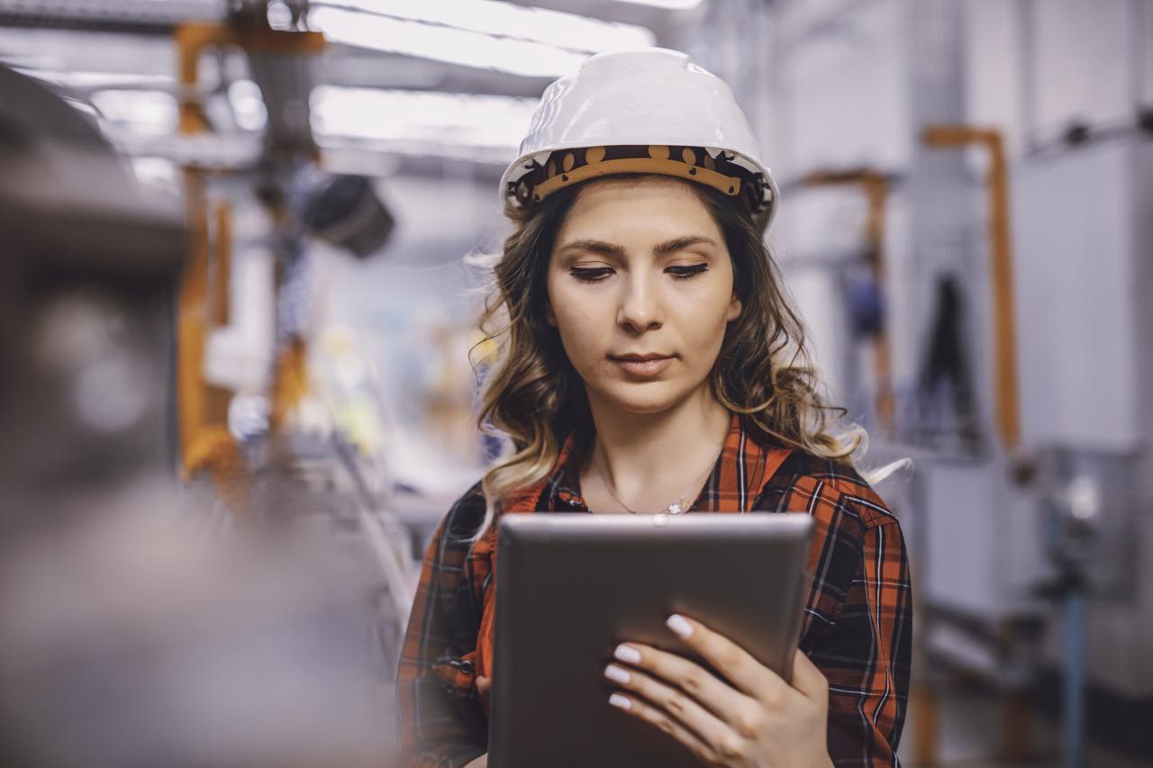 A construction worker using an ipad