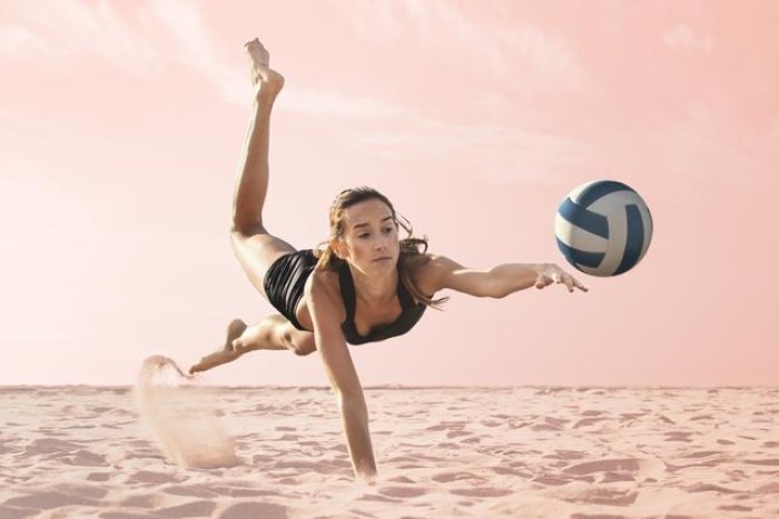 A lady playing volleyball